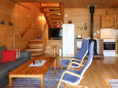 a living room with a couch and a table at Holiday Home Krokeggi by Interhome in Arnefjord