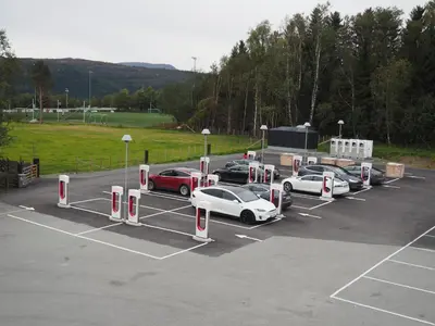 a group of cars parked in a parking lot at Berkåk Gjestegård in Berkåk