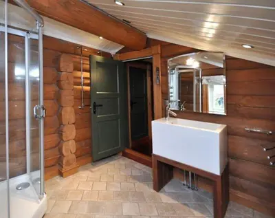 a bathroom with a sink and a shower and a mirror at Storsten 695 - Trysil in Trysil