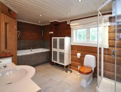 a bathroom with a toilet and a tub and a sink at Storsten 695 - Trysil in Trysil