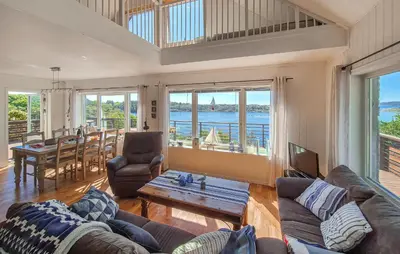 a living room with a couch and a table at Awesome Home In Sveio With Wifi in Sveio