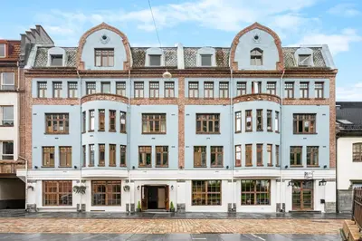a large white building with a lot of windows at BREEZE Hotel Victoria - Self-Service in Bergen