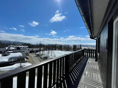 a balcony with a view of a snow covered yard at Central Apartment With 3 Bedrooms And Balcony in Beitostøl