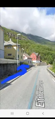 a view of a street with houses on a hill at Gulthus in Odda