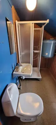 a bathroom with a toilet and a sink at Buviken Nordre, Femund in Sømådalen