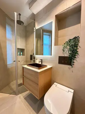 a bathroom with a toilet and a sink at Bergen City Apartment in Bergen