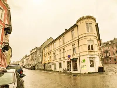 a row of buildings on a city street at Celestial Bergen Central Apartment in Bergen