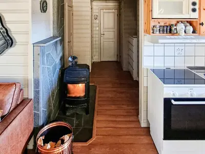 a hallway of a kitchen with a stove at 6 person holiday home in Flatanger in Lauvsnes