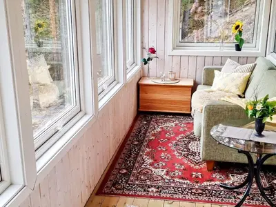 a living room with a couch and a table at 6 person holiday home in Flatanger in Lauvsnes