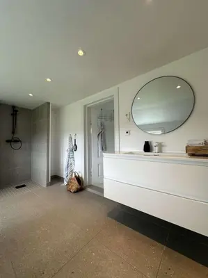 a bathroom with a sink and a mirror at Sjønært småbruk in Bud