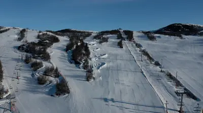 an aerial view of a ski lift in the snow at Cozy 2-Bedroom Retreat In The Heart Of Nature in Beitostøl