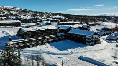 an aerial view of a resort in the snow at Small Family Retreat Two Bedrooms And Easy Access in Beitostøl