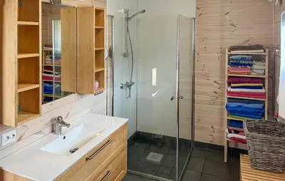 a bathroom with a glass shower and a sink at Beautiful Home In Vassenden in Vassenden