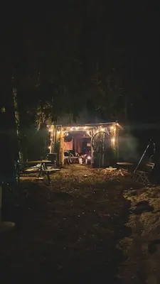a house lit up at night with lights at Koia Guesthouse in Flesberg