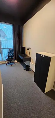 a room with a computer and a desk and a window at Lilleby Apartment in Trondheim