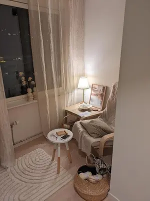 a living room with a couch and a table at Meget hjemmekoseligISentraltINyoppusset leilighet in Bergen