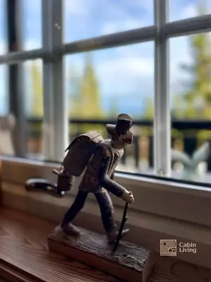 a figurine of a man with a hat and a wand at Cozy spacious cabin with sauna at Natrudstilen in Ringsaker