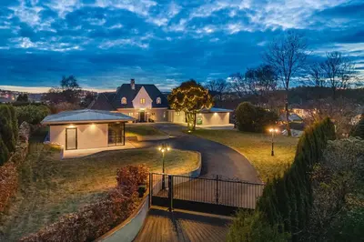 a house with a gate and a driveway at Hopsneset Luxury Villa in Bergen