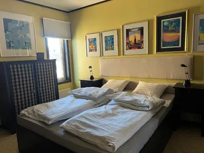 a bedroom with two beds with pillows on it at Fjordgata i Trondheim in Trondheim
