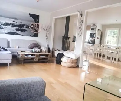 a living room with a couch and a table at Hus i Stryn in Stryn