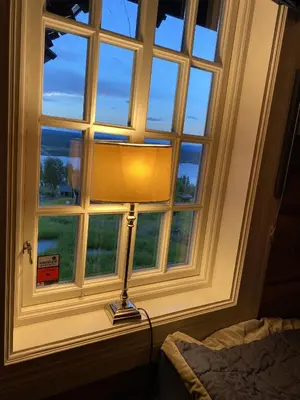 a lamp sitting in front of a window at Cozy family cabin with stunning location on Golsfjellet in Golsfjellet