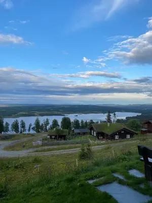 a group of houses on a hill with a lake at Cozy family cabin with stunning location on Golsfjellet in Golsfjellet