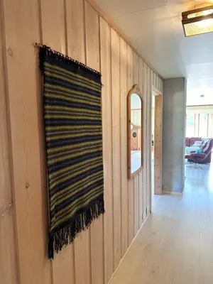 a room with a striped curtain on a wall at Villa Soltun in Ringebu