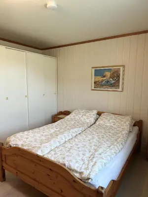 a bedroom with a large bed in a room at Villa Soltun in Ringebu
