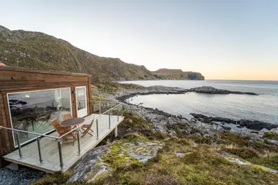 a house on the shore of a body of water at Runde Panorama - Eden in Runde