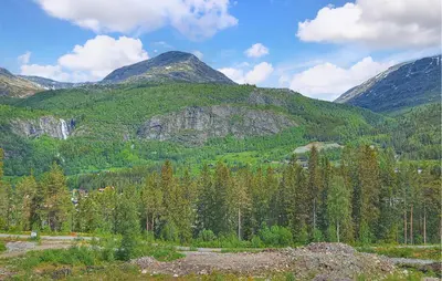 a mountain with trees and mountains in the background at Amazing Apartment In Hemsedal With Wifi in Hemsedal