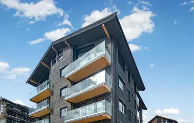 a building with glass balconies on the side of it at Amazing Apartment In Hemsedal With Wifi in Hemsedal