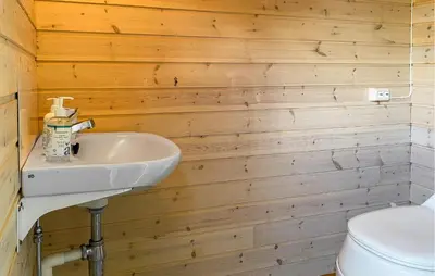 a bathroom with a sink and a toilet at 2 Bedroom Pet Friendly Home In Haddal in Haddal