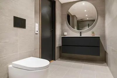 a bathroom with a toilet and a sink and a mirror at Mountain View Apartment - penthouse in Stranda