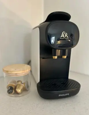a coffee maker is sitting on a counter at Newly renovated studio apartment - free parking and EV docking in Trondheim