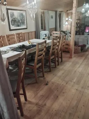 a dining room with a table and chairs at Langlete gjestehus in Gilset