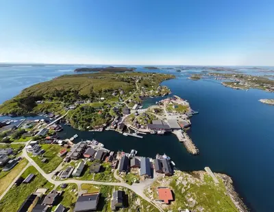 an aerial view of a small island in the water at Boathouse in Mausund in Bogøyvær