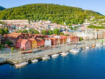 an aerial view of a harbor with boats in the water at View to Bryggen - Renovated dec 24 - Historic cobblestone street in Bergen