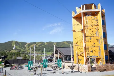 a large yellow play structure with tables and benches at Cozy Ski-In Ski-Out Apartment on Geilo, Stunning Views! in Geilo