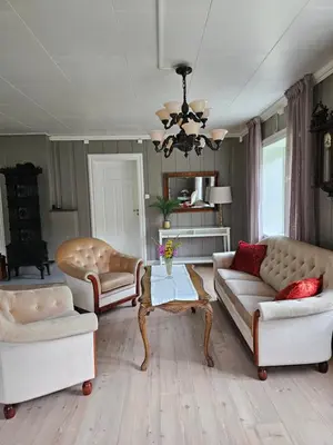 a living room with two couches and a table at Familie og gruppevennlig hus 12 senger 240kvm in Oppdal