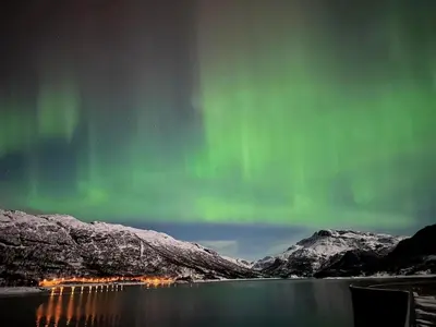 an image of the aurora borealis over a lake at Handeland Lodge Near Trolltunga and Pulpit Rock Sleeps 18 with Sauna in Sauda
