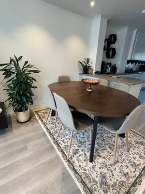 a wooden table and chairs in a living room at Sunny gateaway Room in Lerstad, Suitable for two guests in Ålesund