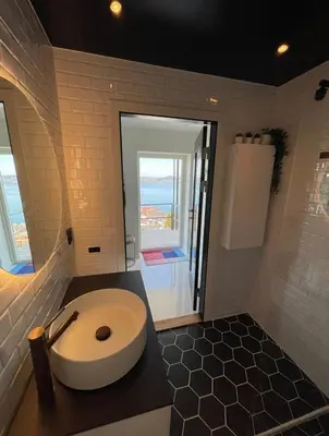 a bathroom with a toilet and a sink at Unique apartment with fantastic views in Bergen