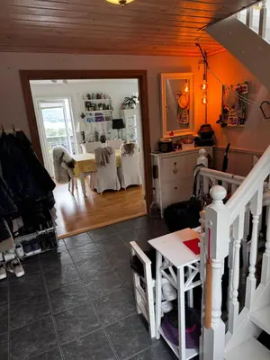 a living room with a dog standing in a room at Villa with a view in Morviki