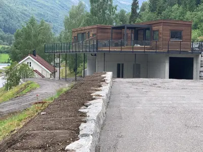a house being built on top of a hill at Stryn Golden Resort - Panorama I in Stryn