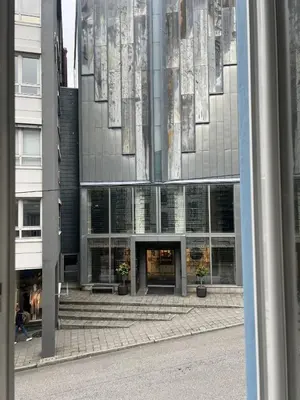 a tall building with a lot of windows at Ålesund sentrum Parkgata in Ålesund