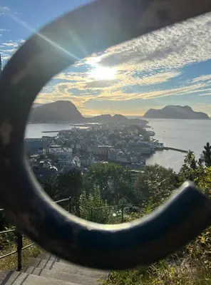 a view of the city of vancouver through a metal ring at Ålesund sentrum Parkgata in Ålesund