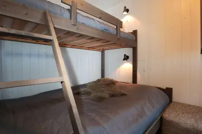 a bunk bed in a small room with a bunk bedutenewayangering at Hemsedal, Ski in Ski out, Skarsnuten Panorama 55 in Tuv