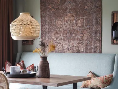 a living room with a table and a couch at Danebu Kongsgaard - Boutique Hotel in Aurdal