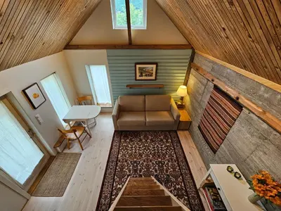 an overhead view of a living room with a couch and a table at Sigurd's Tiny House in Vossevangen