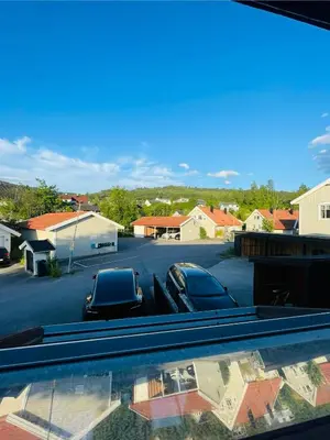 a truck parked in a parking lot with two cars at Leilighet med særpreg in Lillehammer